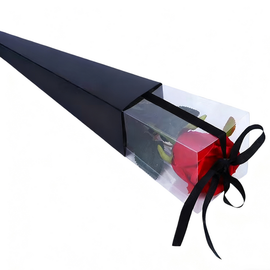 Red rose in a clear cone with black ribbon on a white background